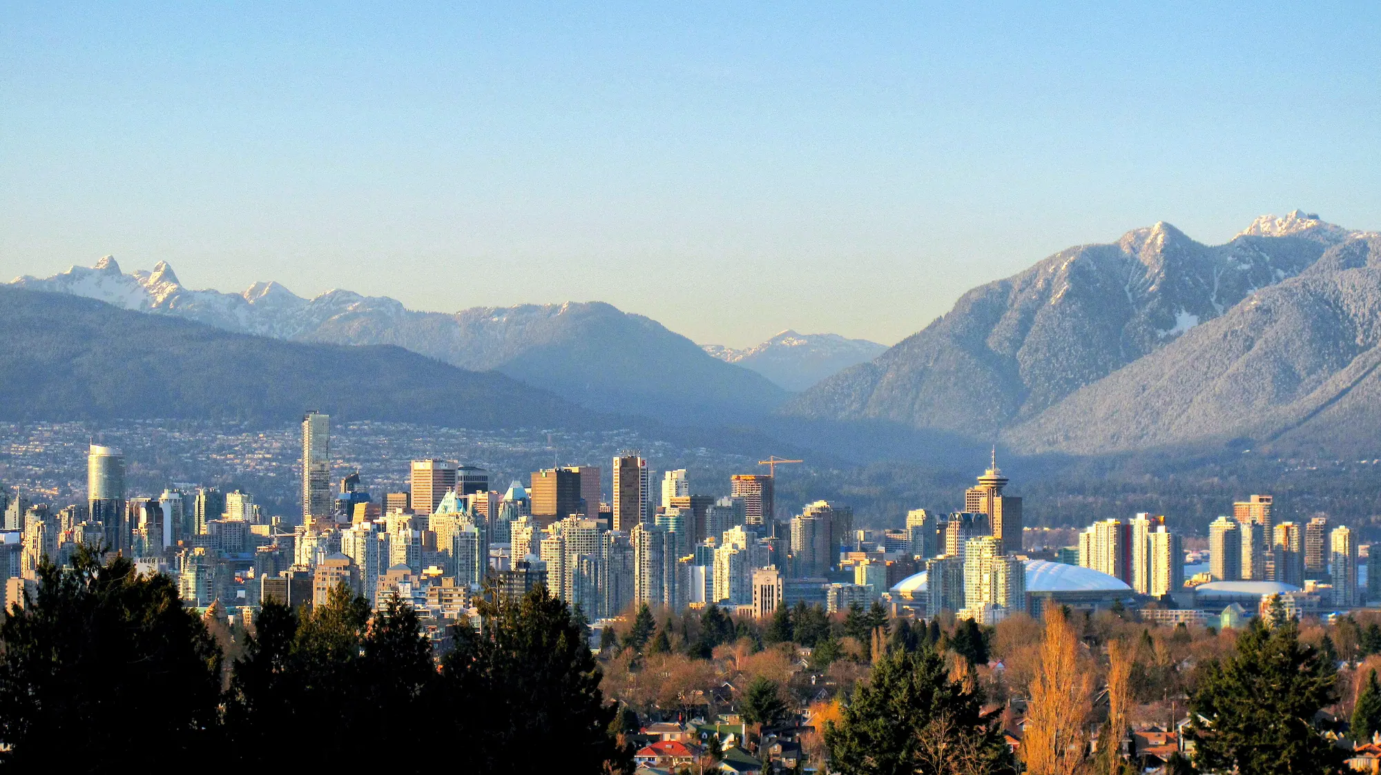 The Vancouver skyline with the North Shore mountains rising behind the towers